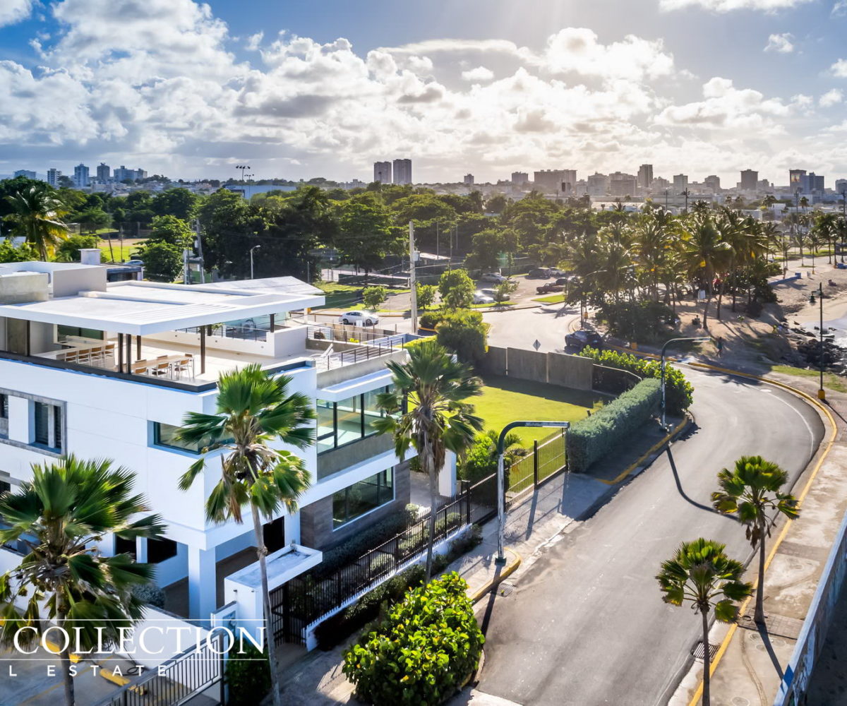 An idyllic Oceanfront Modern Mansion with sublime and serene ocean vistas and sounds, corner lot in Park Boulevard next to Ocean Park. Puerto Rico Luxury Collection Real Estate