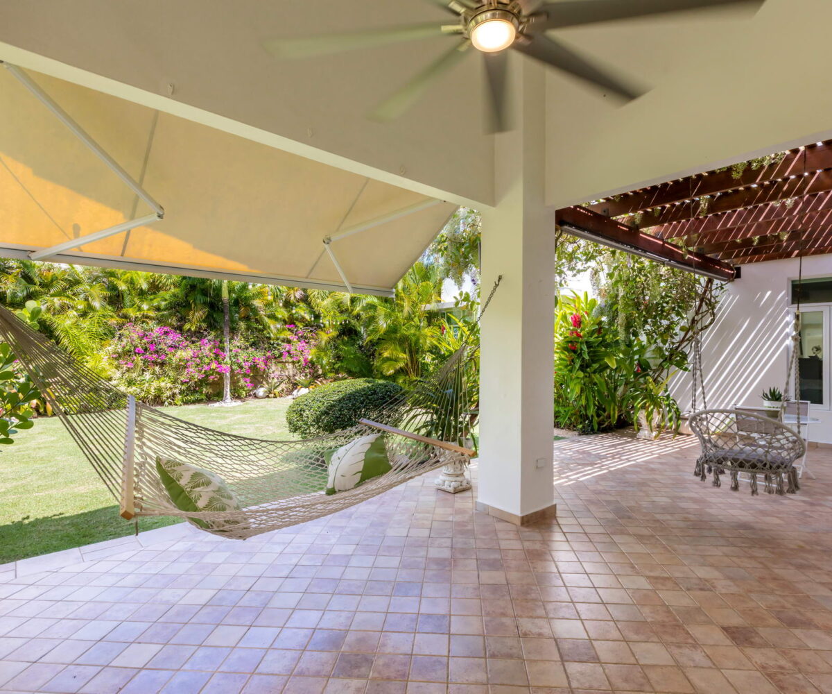 Paseo Las Palmas house at Dorado, Puerto Rico for sale. 4 bedrooms, 3.5 full bathrooms, covered terrace with carefully groomed landscaping.