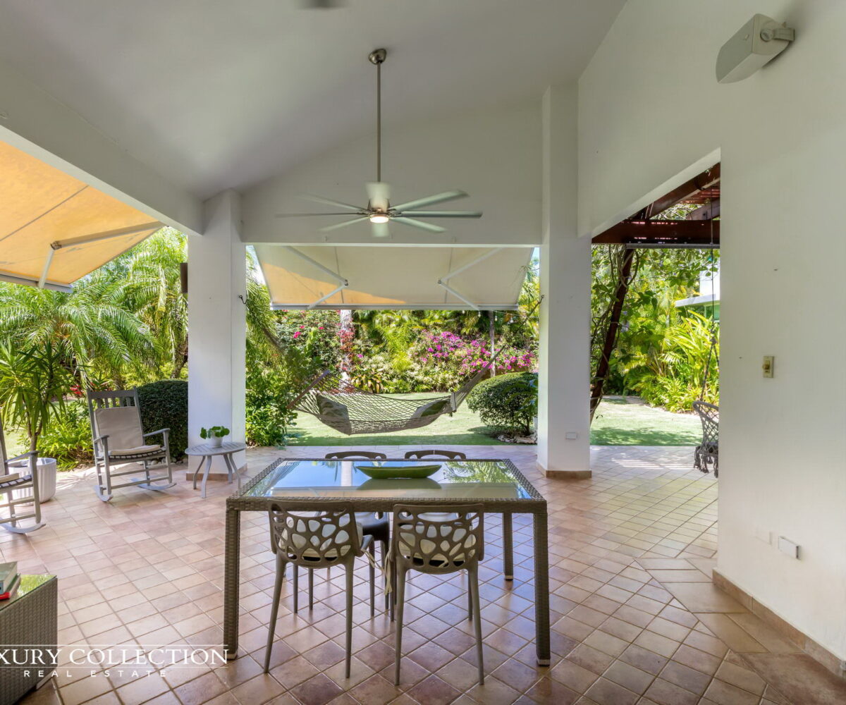 Paseo Las Palmas house at Dorado, Puerto Rico for sale. 4 bedrooms, 3.5 full bathrooms, covered terrace with carefully groomed landscaping.