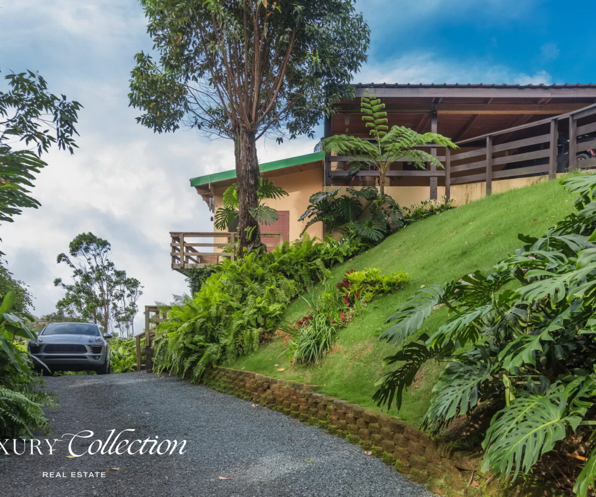 1.5 acres two-story country house in the mountains of Cayey Puerto Rico for sale with 3 bedrooms and 3.5 bathrooms. Lake and mountain views, Luxury Collection Real Estate