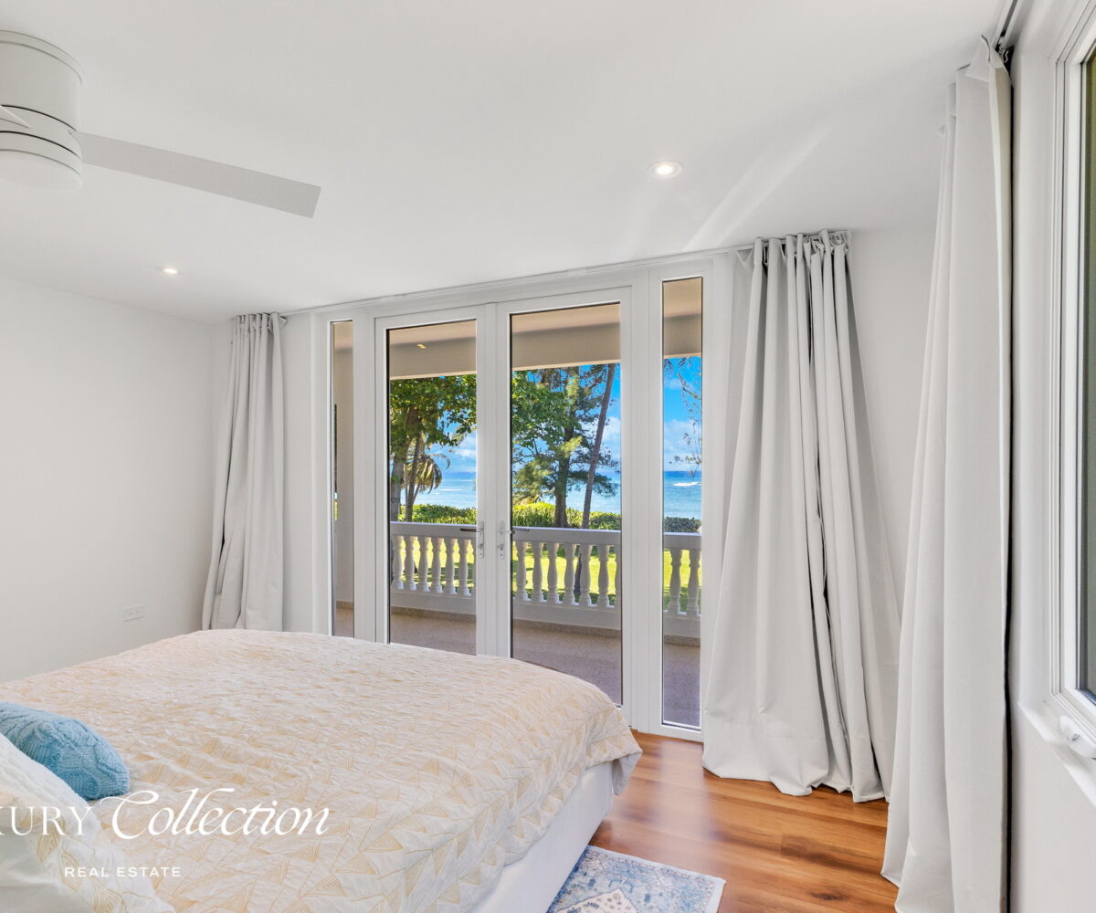 2-story beachfront home with 5 bedrooms, 4 baths, 2 kitchens, and an abundant outdoor space for entertaining in Vega Baja Puerto Rico.