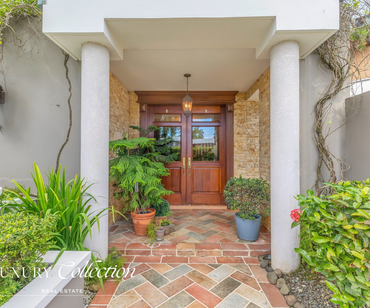 Garden Hills North neighborhood, Guaynabo. Spacious backyard. With 4 beds, 4 baths, 2 car garage. Luxury Collection Real Estate, Puerto Rico.