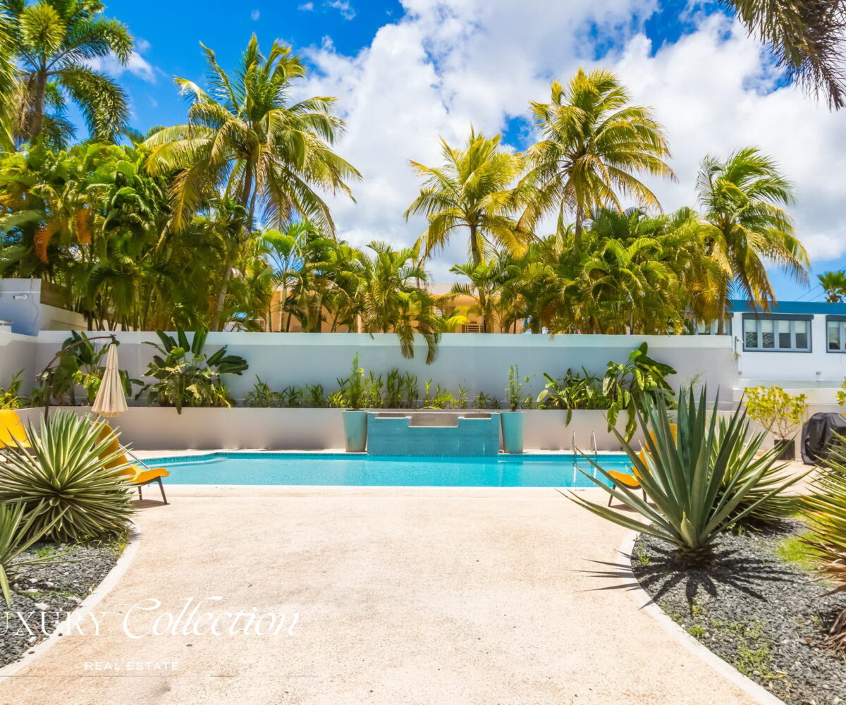 Paseo San Juan House for sale Puerto Rico. Remodeled 5,095 sq. ft. residence on a 945 sq. meter lot. 4 beds (convertible to 5) and 3.5 baths. Alex Herrera Luxury Collection Real Estate.