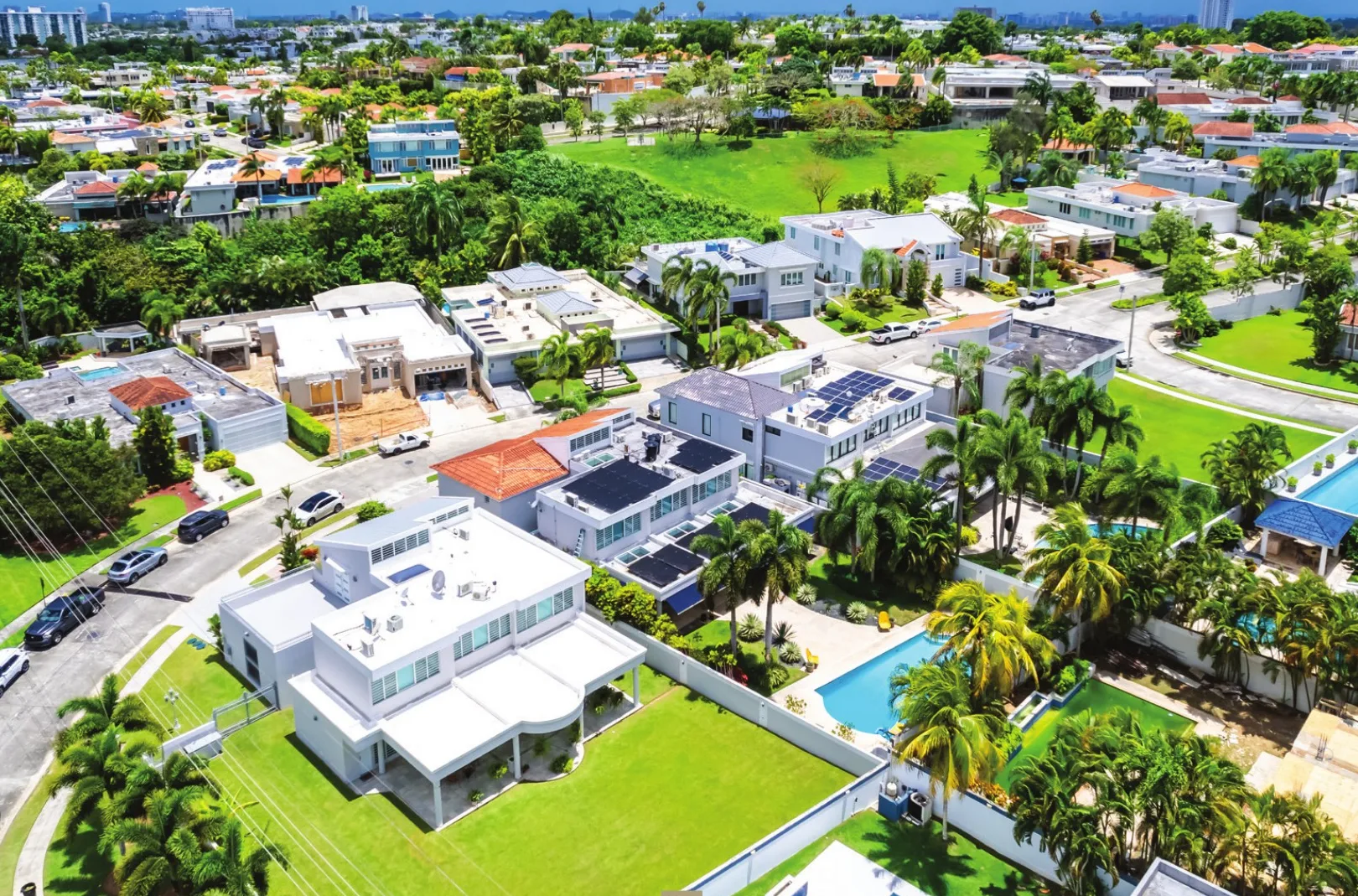 Aerial view of luxury homes with pools in a San Juan, Puerto Rico residential community